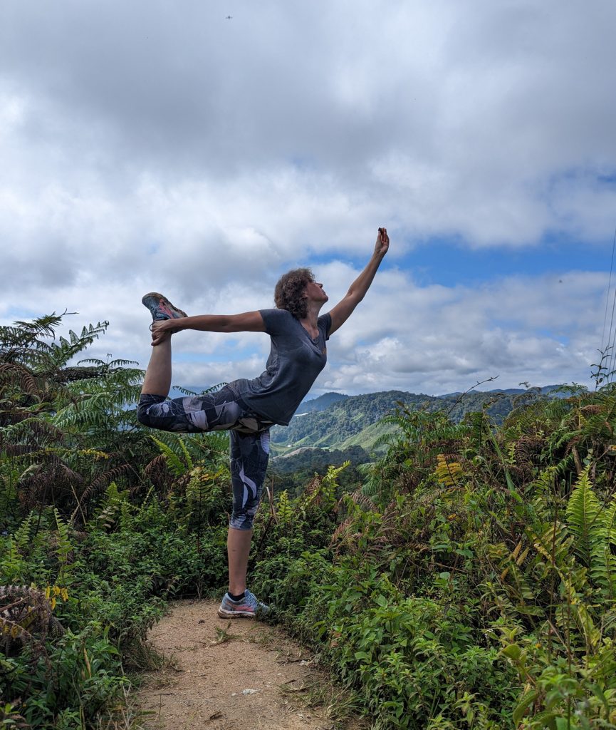 Yoga pose in between the tea plantation - Malaysia